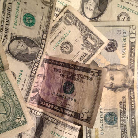 Pile full of money dollar bills