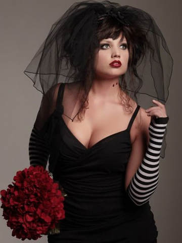 Beautiful goth bride to be wearing a sexy black wedding dress and black veil
