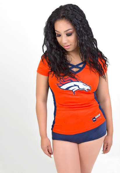 Boudoir photography of a curvy woman wearing a Denver Broncos football jersey