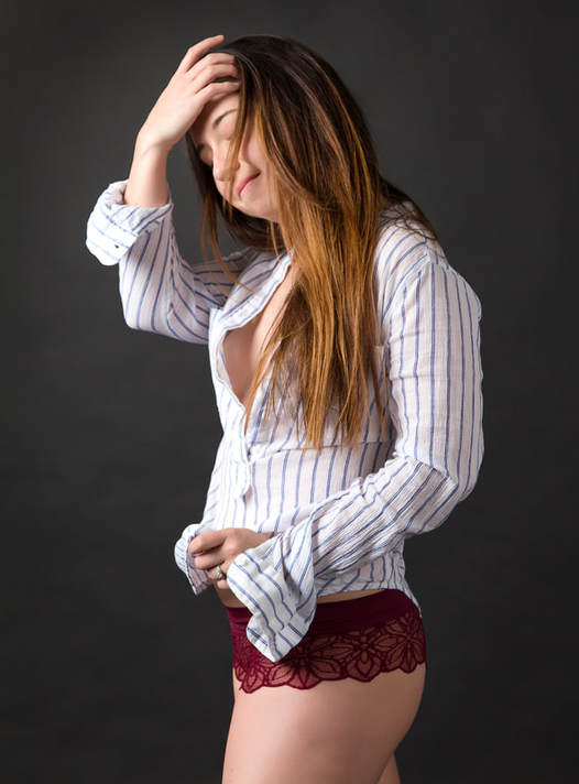 beautiful young woman wearing panties and a dress shirt
