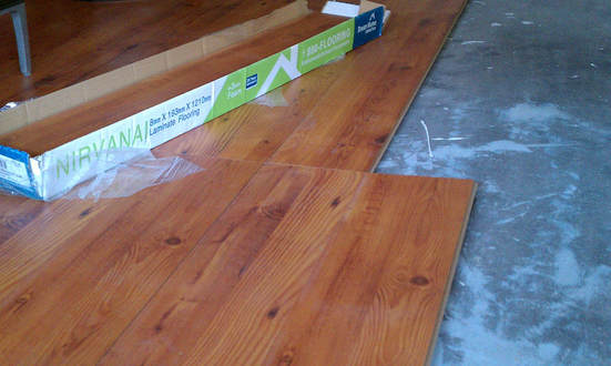 Laminate wood flooring installed in garage studio 