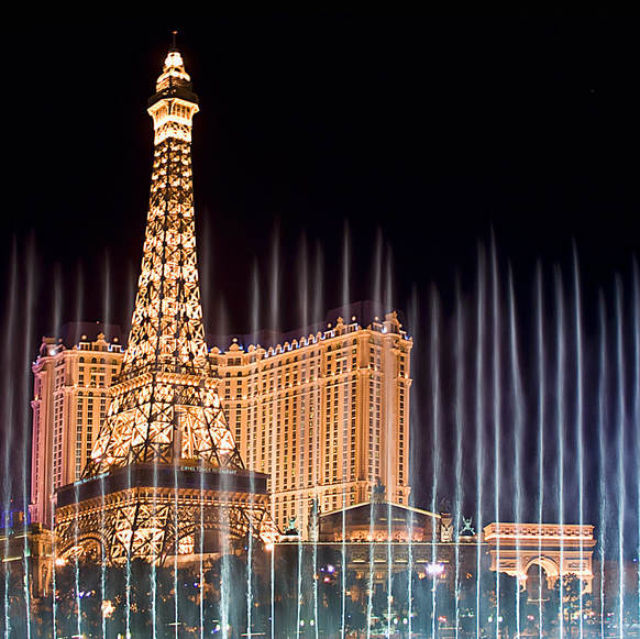 Paris Hotel and Casino in Las Vegas photographed through the Bellagio fountains