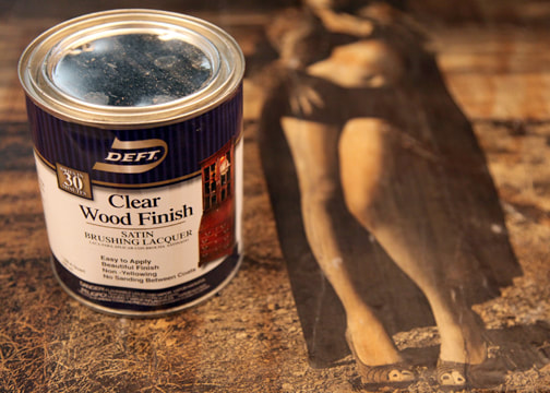 Apply clear coat wood finish lacquer to seal and protect the wood and transferred photo  on wood